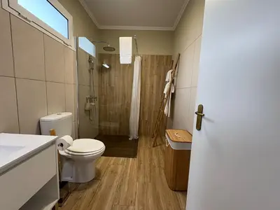 a room with a bed with towels on it at Villa Alta Vista in São Jorge