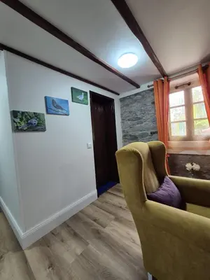 a living room with a couch and a window at Casa Rosa in Camacha