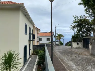a street with a white building and a street light at The Vista House in Ponta Delgada