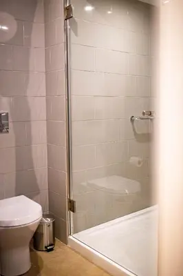 a bathroom with a shower with a toilet at ISABELLA STUDIOS FUNCHAL in Funchal