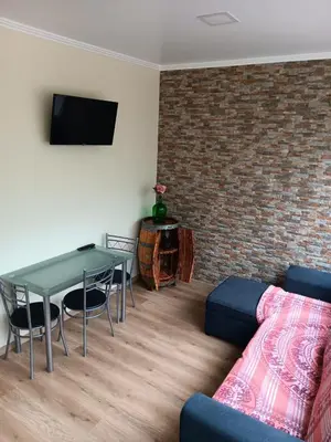 a living room with a table and a couch at House Luís Ornelas in Fajã do Mar