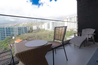 a bathroom with a sink and a toilet and a shower at Apartamento Zona Turística in Funchal