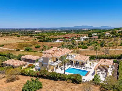 an aerial view of a villa with a swimming pool at Casa Ferrel - Luxury 9 Bedroom Villa with Indoor & Outdoor Pools in Lagos