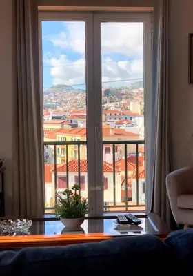 a large window with a view of a city at Costa's OldTown House in Funchal in Funchal