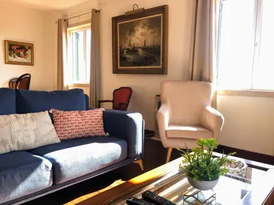 a living room with a couch and a chair at Costa's OldTown House in Funchal in Funchal