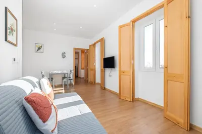 a bedroom with a bed and a hallway with a table at Casa os Gauleses in Gaula