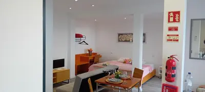 a living room with a couch and a table at Vista Funchal Ⅰ in Funchal