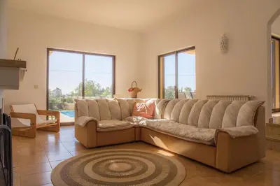 a large couch in a living room with windows at D05 - Amadeus Sunset Villa in Mato Porcas