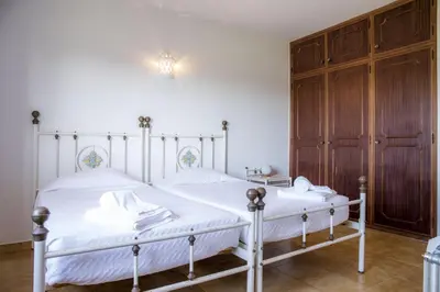 a bedroom with two beds with white sheets at D05 - Amadeus Sunset Villa in Mato Porcas