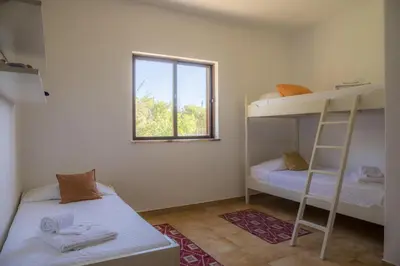 a room with two bunk beds and a window at D05 - Amadeus Sunset Villa in Mato Porcas