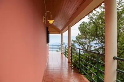 a balcony with a view of the ocean at Quinta do Santo by LovelyStay in Santo da Serra
