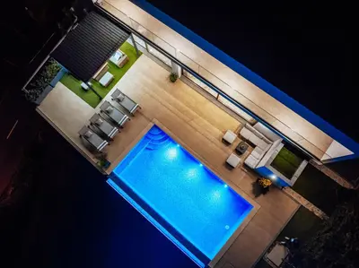 an overhead view of a swimming pool in a hotel room at Lê Maison Deluxe Madeira - Where Peace is breathed and Luxury is felt! in Ribeira Brava