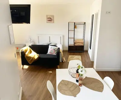 a living room with a couch and a table at Machico center w/ terrace 5 min beach in Machico