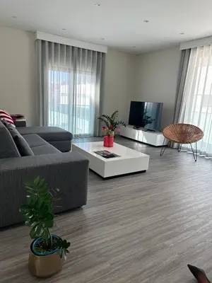 a living room with a couch and a table at Raphael Funchal Views Apartment in Funchal