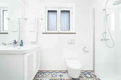 a bathroom with a toilet and a sink and a shower at Casa Pereira in Relógio do Poiso