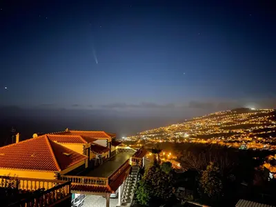 a view of a city at night with lights at Casa Câmara in Arco da Calheta