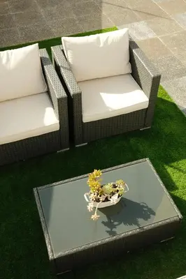 two chairs and a table with a bowl of flowers at CASA15 Guesthouse Funchal in Funchal