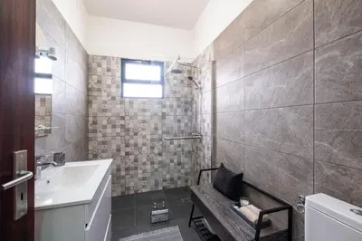 a bathroom with a sink and a toilet at Casa Monte by GALMI in Funchal