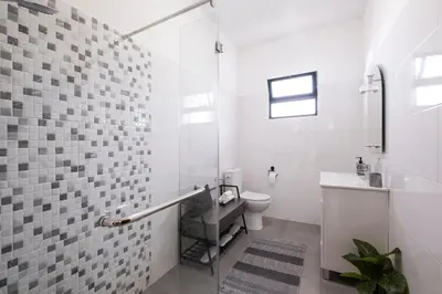 a white bathroom with a toilet and a sink at Casa Monte by GALMI in Funchal