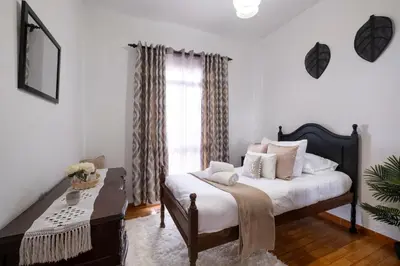 a bedroom with a bed and a window at Casa Monte by GALMI in Funchal