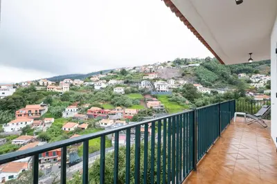 a balcony with a view of a city at Casa Monte by GALMI in Funchal