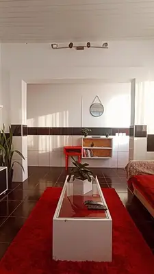 a bedroom with a bed and a wooden ceiling at Kanela Guest House in Machico