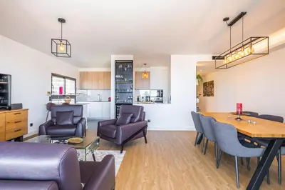 a living room with a table and chairs at SkyView Penthouse Apartment by MHM in Funchal