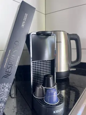 a coffee maker on a counter next to a knife at Lucky Lemons - Boutique Houses Madeira (Studio) in Calheta