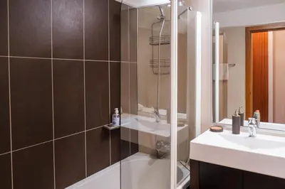 a bathroom with a shower and a sink at GuestReady - Scenic Retreat with Seaview in Funchal