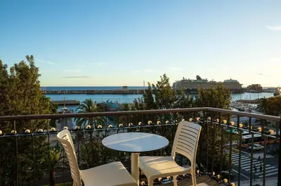 a table and chairs on a balcony with a view at King David Suites by Homie in Funchal