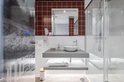 a bathroom with a sink and a shower at King David Suites by Homie in Funchal