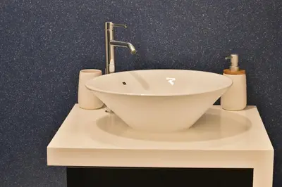 a white sink with a faucet on a counter at Villa Leonor Cliffside Retreat in Calheta