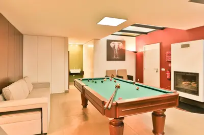a billiard room with a pool table in it at Villa Leonor Cliffside Retreat in Calheta
