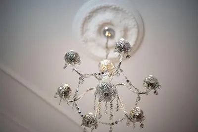 a chandelier hanging from a ceiling at Casa Pereira – Snooker, Wi-Fi, Bbq, Pool in Relógio do Poiso