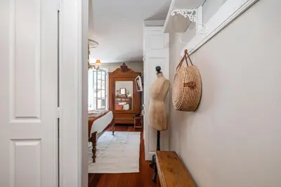 a hallway with a stairway leading to a living room at Casa Grande da Camélia in São Vicente