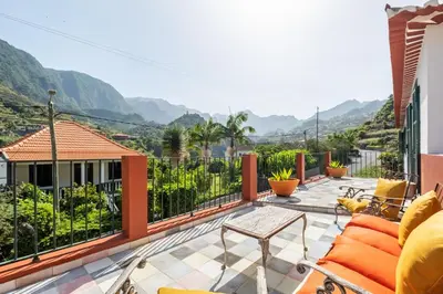 a balcony with a view of the mountains at Casa Grande da Camélia in São Vicente