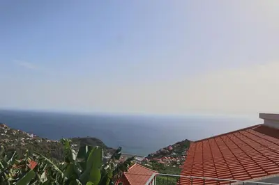 a view of the ocean from a house at Fifty's House 2 By Sam Houses in Ribeira Brava