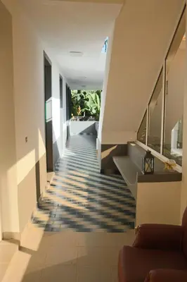 a staircase in a house with blue and white floors at Fifty's House 2 By Sam Houses in Ribeira Brava