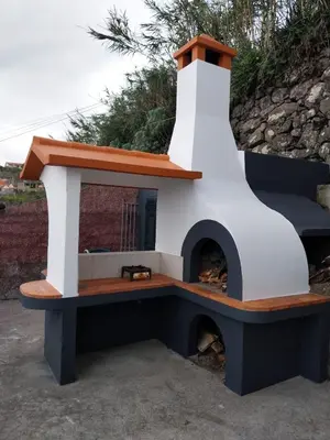 a lighthouse sitting on top of a bench at Casa Do Pico in São Vicente