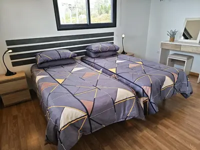 a bedroom with a large bed with pillows on it at Maravilha da Costa in Ponta do Pargo