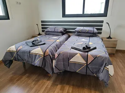 two beds sitting next to each other in a bedroom at Maravilha da Costa in Ponta do Pargo