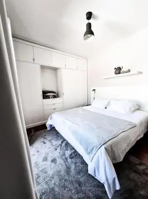 a white bedroom with a bed in a room at Santa Luzia's Pearl III -Two Bedroom Apartment in Funchal