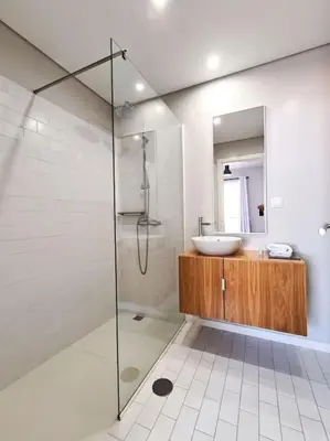 a bathroom with a sink and a glass shower at Santa Luzia's Pearl IV - Two bed Apartment in Funchal