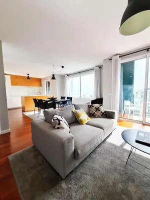 a living room with a couch and a table at Santa Luzia's Pearl IV - Two bed Apartment in Funchal