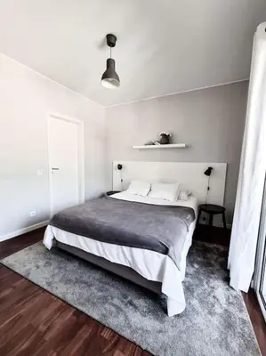 a bedroom with a large bed in a white room at Santa Luzia's Pearl IV - Two bed Apartment in Funchal