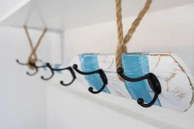a row of glasses hanging from a rope at Abrigo do Pescador in Aljezur
