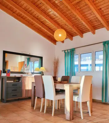 a dining room with a table and chairs at Varandas Guest Apartment in Aljezur