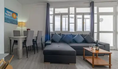 a kitchen with a stove top oven next to a sink at Duas Torres View Apartment in Funchal