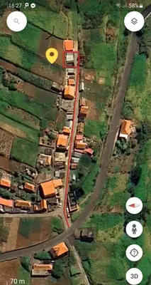 an aerial view of a road with houses on it at Casa Jardim in Ponta do Pargo