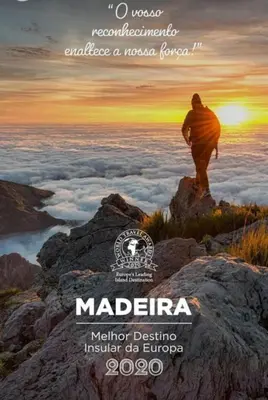 a poster of a man standing on top of a mountain at Casa Jardim in Ponta do Pargo